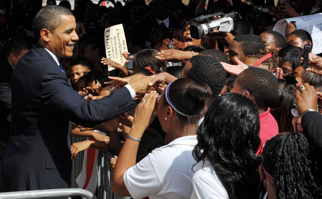 Barack Obama greets students at Dr Martin Luther King charter school 