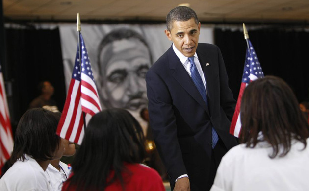 Barack Obama talks to students at Dr Martin Luther King charter school in New Orleans