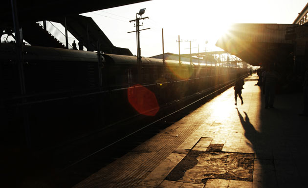24 hours: A boy runs on a platform of the NJP railway station near Siliguri