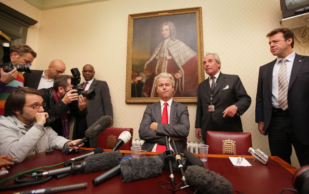 Geert Wilders: Geert Wilders is watched by Lord Pearson as he speaks to reporters
