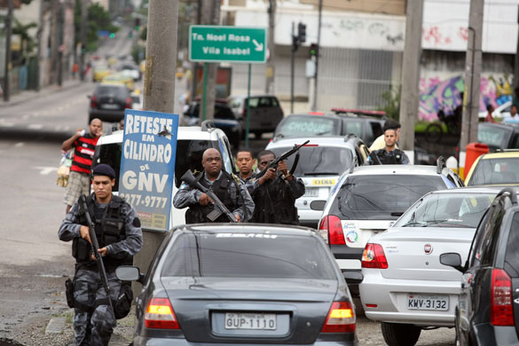 Rio de Janeiro: Police personnel from a tactical unit take positions