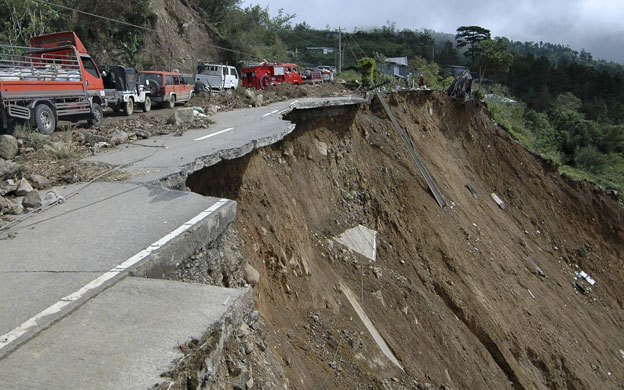 Philippines flooding: 18 October 2009: Vehicles travel along the damaged Halsema Highway