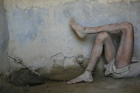 2 October 2009: Jalalabad, Afghanistan: A man who is deemed insane 