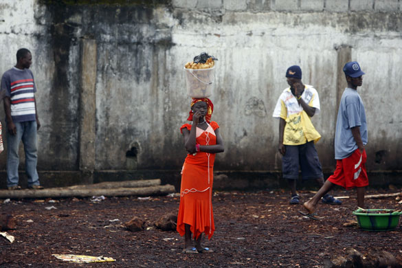 2 October 2009: Conakry, Guinea: A woman selling food