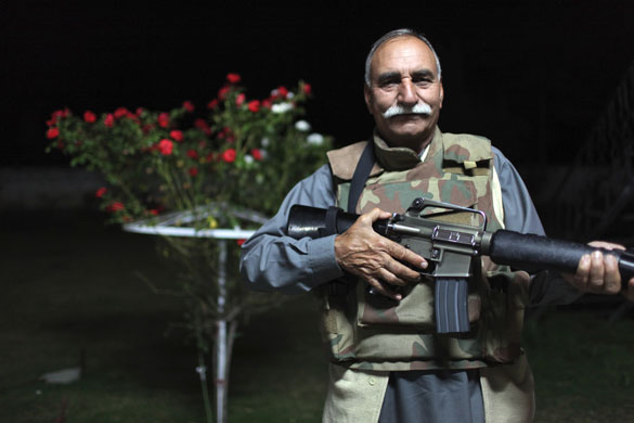 Swat Valley: Majid Ullah Khan, a landlord from the Swat Valley, armed with an M-16 rifle