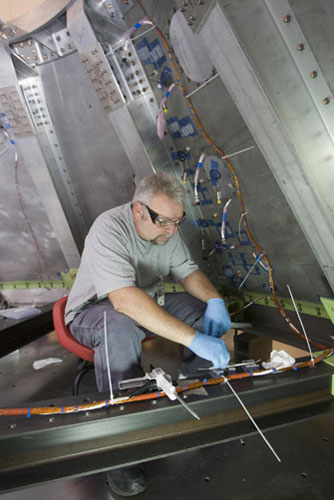 Ares I-X :  Crew Module simulator in a stacking test in the NASA Langley hangar