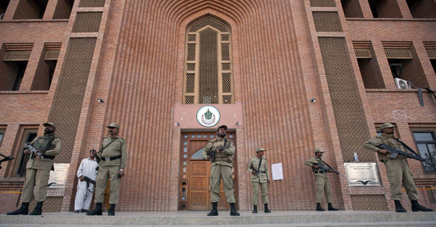 Islamabad suicide bomb: Security forces stand guard outside a building