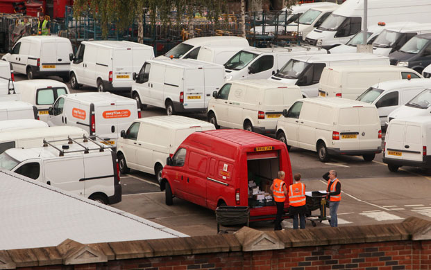 Postal strike: London: Royal Mail employees believed to be managerial staff load a van