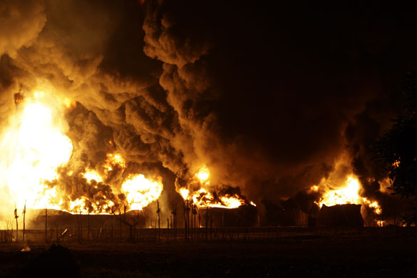 24 hours: Fuel tanks burn at a petroleum depot
