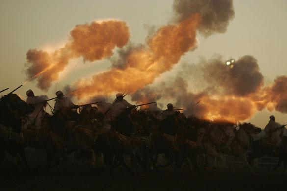 24 hours: El Jadid Morocco: Riders shoot their guns during the traditional horse show
