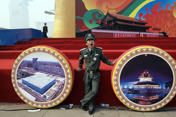 24 hours: Beijing, China: A Chinese security guard yawns during the Tourism Festival