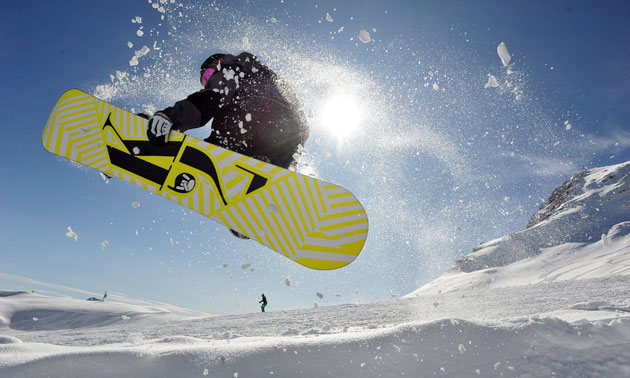 24 hours: A snowboarder performs a jump at the Zugspitze glacier ski area
