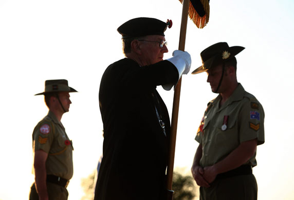 24 hours: A Royal British Legion flagbearer at commemoration ceremonies at El Alamein