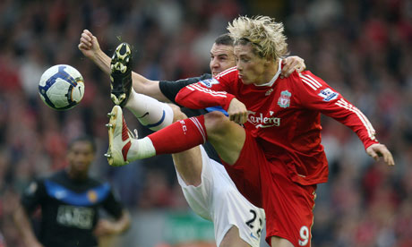 Liverpool gallery: Fernando Torres and John O'Shea battle for possession