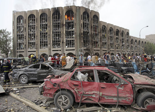 Bombs in Baghdad: Iraqis gather at the site of a massive bomb attack in Baghdad, Iraq