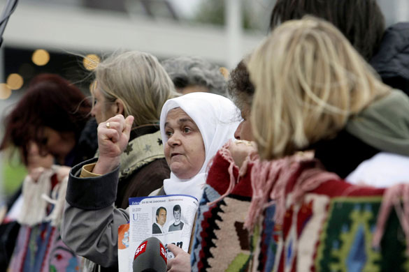 Radovan Karadzic: Bosnian women protest at the start of the Karadzic's trial