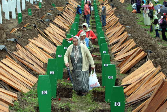 Radovan Karadzic: Bosnian Muslim women at the Potocari Memorial Centre burial ceremony