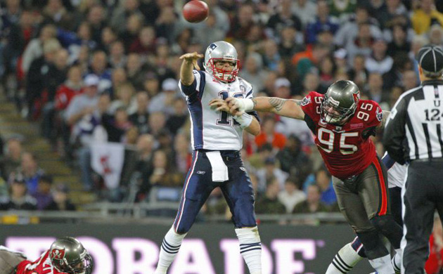 <b>New England Patriots 35, Tampa Bay  Buccaneers 7:</b> Patriots quarterback makes a throw during their game against the Buccaneers at Wembley. Brady threw for 308 yards and three touchdowns as the Patriots (5-2) handed the hapless Buccaneers (0-7) their seventh loss of the season 