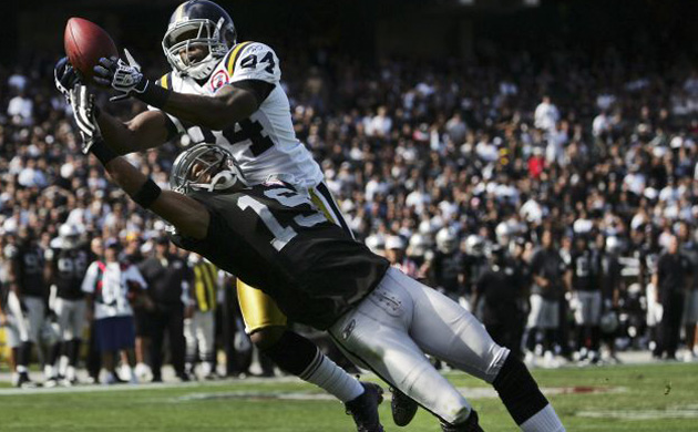 <b>New York Jets 38, Oakland Raiders 0:</b>  New York Jets cornerback Darrelle Revis, right, intercepts a pass intended for Oakland Raiders wide receiver Todd Watkins. Rookie quarterback Mark Sanchez followed up his worst performance in the NFL with a solid showing against the 2-5 Raiders. Raiders quarterback JaMarcus Russell threw for two interceptions and was replaced by backup Bruce Gradkowski