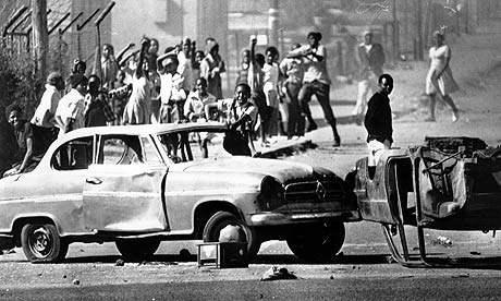 People in Soweto use cars as roadblocks during a riot in June 1976.