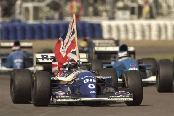 British Grand Prix: Damon Hill holds the Union flag after winning the 1994 British Grand Prix