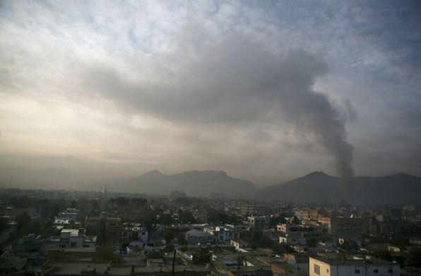 kabul attacks: Smoke rises from a U.N. guest house during a gunbattle 