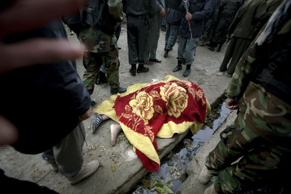 kabul attacks: unidentified dead body lies outside a U.N. guest house