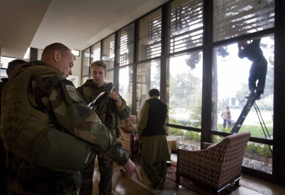 kabul attacks: foreign soldiers inspect the damage at the  Serena Hotel