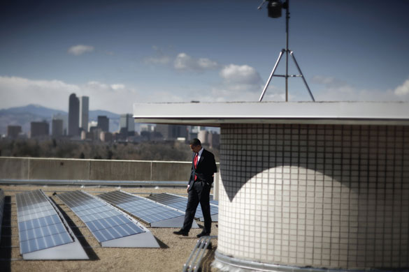 Environment decade: President Barack Obama tours the solar array at the Denver Museum