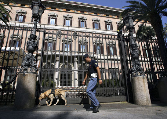 US embassies: An Italian security policeman checks the entrance of the American Embassy