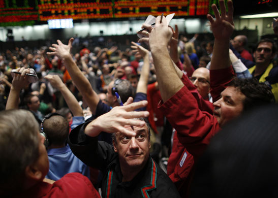 Week in business: Traders work in the S&P 500 pit at the Chicago Mercantile Exchange