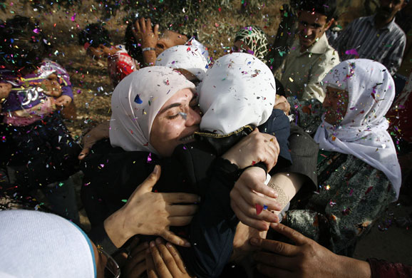 24 Hours in Pictures: Female Palestinian prisoner is hugged upon her arrival in Jenin