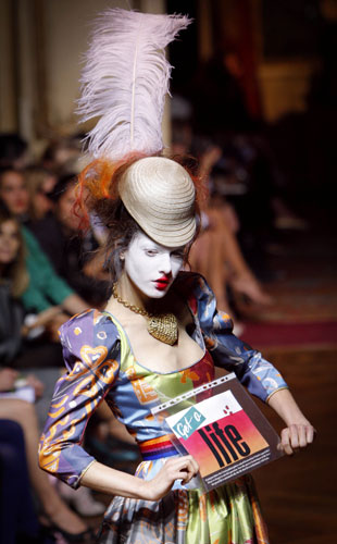 24 Hours in Pictures: A model presents an outfit by British designer Vivienne Westwood in Paris