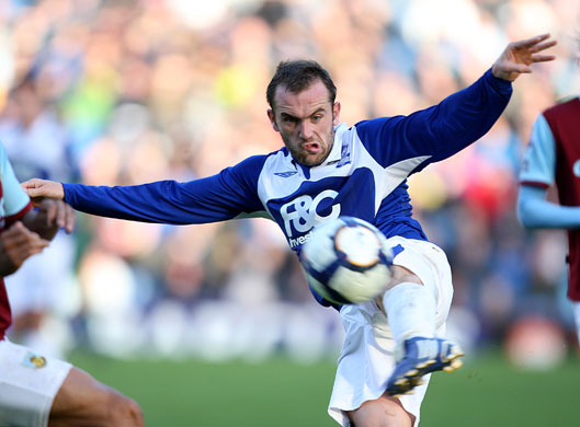 Saturday Premiership: Birmingham's  James McFadden puts all his effort into clearing the ball