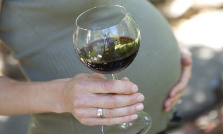 Preganant woman with wine