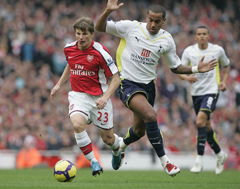 Arsenal v Tottenham: Andrey Arshavin skips past Tom Huddlestone 