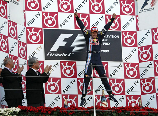 F1 grand prix of Japan: Sebastian Vettel of Germany jumps as he celebrates on the podium