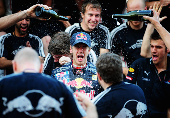 F1 grand prix of Japan: Sebastian Vettel celebrates with team mates in the pitlane