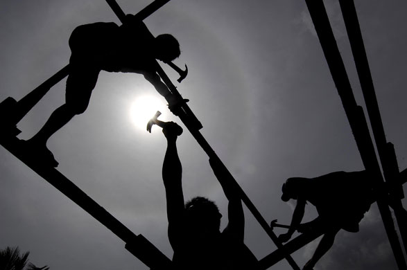 24 hours : Quezon City, Philippines: Flood survivors reconstruct their destroyed house