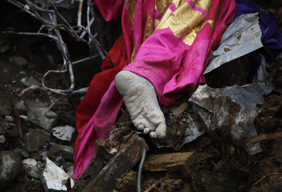 5 October 2009: Indonesia: The foot of a villager who was buried by a landslide