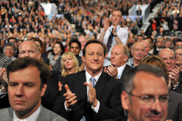 Conservative conference 2: Party leader David Cameron applauds George Osborne's speech
