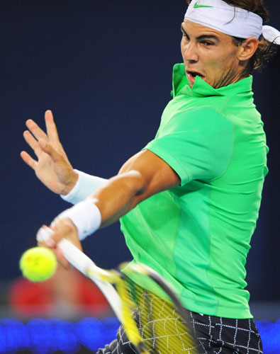 24sport: Top seed Rafael Nadal of Spain returns a shot to Marcos Baghdatis