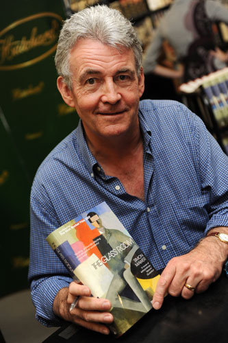 Man Booker 2009: Shortlisted author Simon Mawer poses with a copy of his book The Glass Room