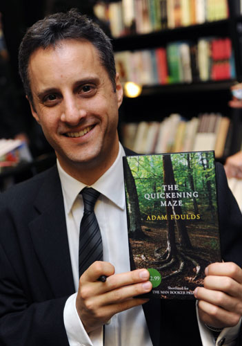 Man Booker 2009: Shortlisted author Adam Foulds poses with his book The Quickening Maze