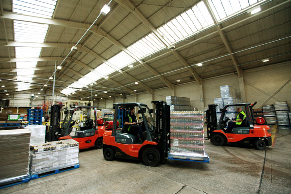cider apple harvest: Bottles of Gaymers cider are transported by forklift truck