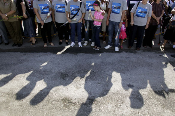 7 October 2009: Havana, Cuba: Relatives stand during a minute of silence