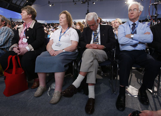 Conservative conference 3: Front row delegates react during a session on law and order 