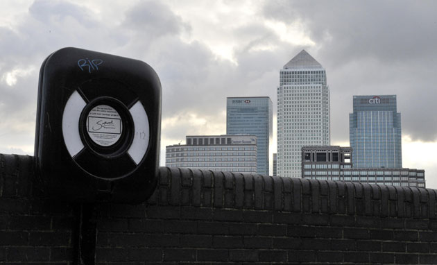 Week in business: Canary Wharf, London with a lifebelt in the foreground