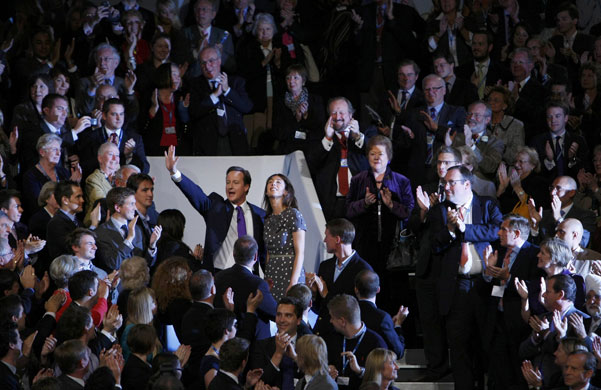 Conservative conference4: David Cameron waves among delegates after delivering his keynote address