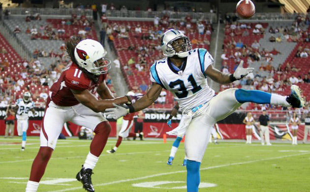 Richard Marshall of the Carolina Panthers intercepts a pass ntended for wide receiver Larry Fitzgerald of the Arizona Cardinals